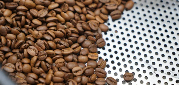 Coffee beans inside coffee maker