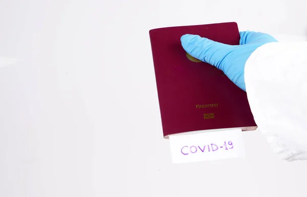Coronavirus and travel concept. Note COVID-19 and passport. Novel corona virus outbreak.  Border control and quarantine of tourists infected with coronavirus.