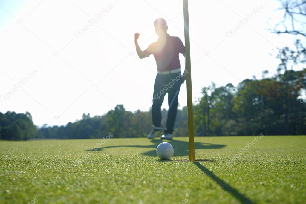 Golfer playing golf in beautiful golf course in the evening golf