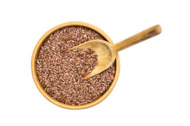 Bir ahşap kase kaşık keten tohumu