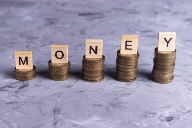  Learning to save money step by step on a gray background