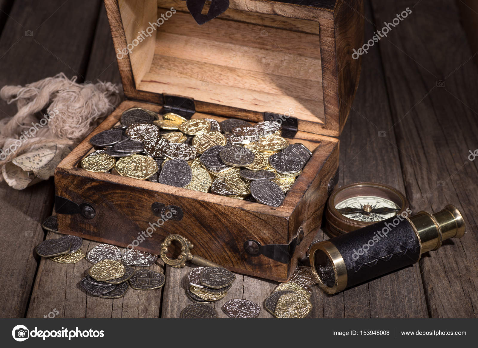 Treasure Chest with Coins Stock Photo by ©chasbrutlag 153948008
