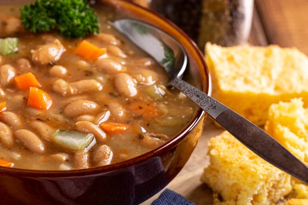 Closeup Bowl Tasty Bean Soup Cornbread Wooden Table — Stock Photo, Image