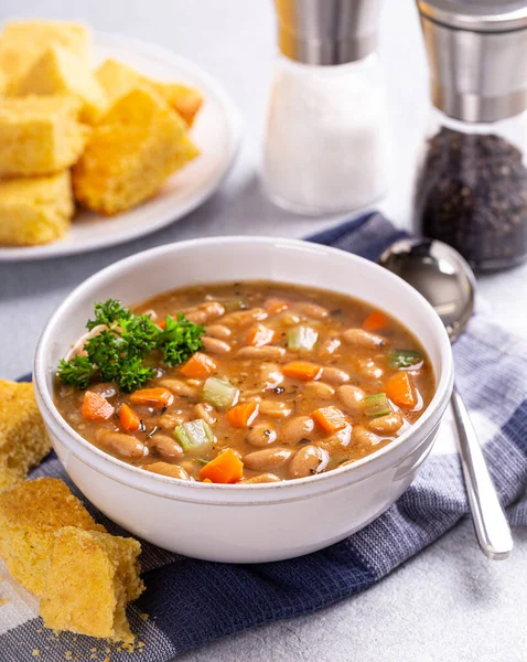 Tasty Bean Soup Carrots Celery White Bowl Corn Bread Side — Stock Photo, Image