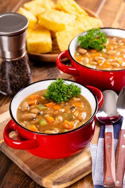 Tasty Bean Soup Vegetables Red Bowl Cornbread Background Wooden Table — Stock Photo, Image