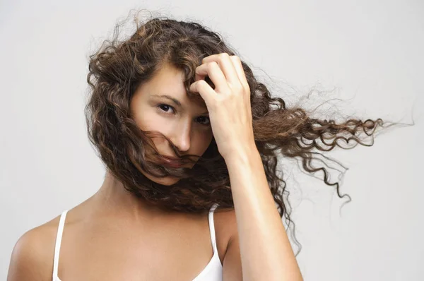 Woman with windswept hair — Stock Photo, Image