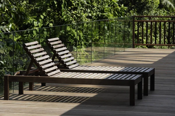 Pair of lounge chairs on deck — Stock Photo, Image