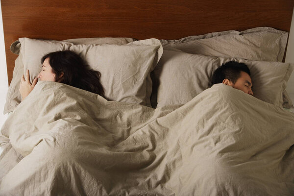 Man and woman sleeping