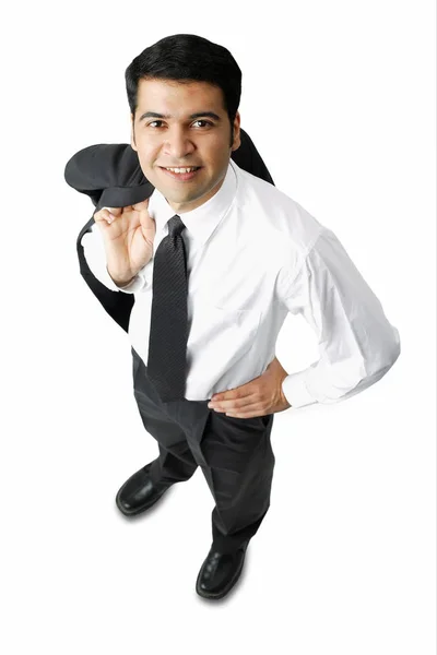 Uomo d'affari che trasporta giacca sopra la spalla — Foto Stock