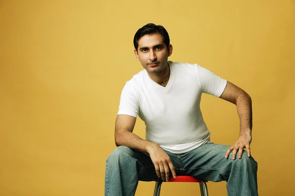 Man sitting on stool