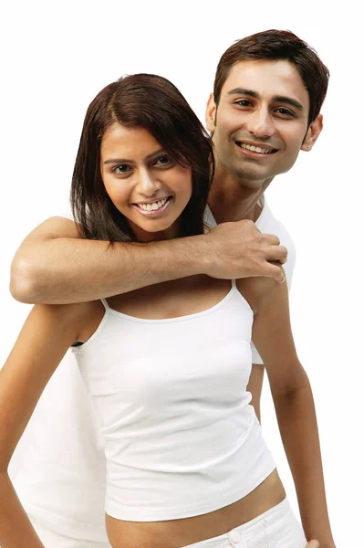 Man hugging woman from behind — Stock Photo, Image