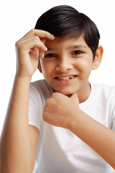 Boy with hand on chin — Stock Photo, Image