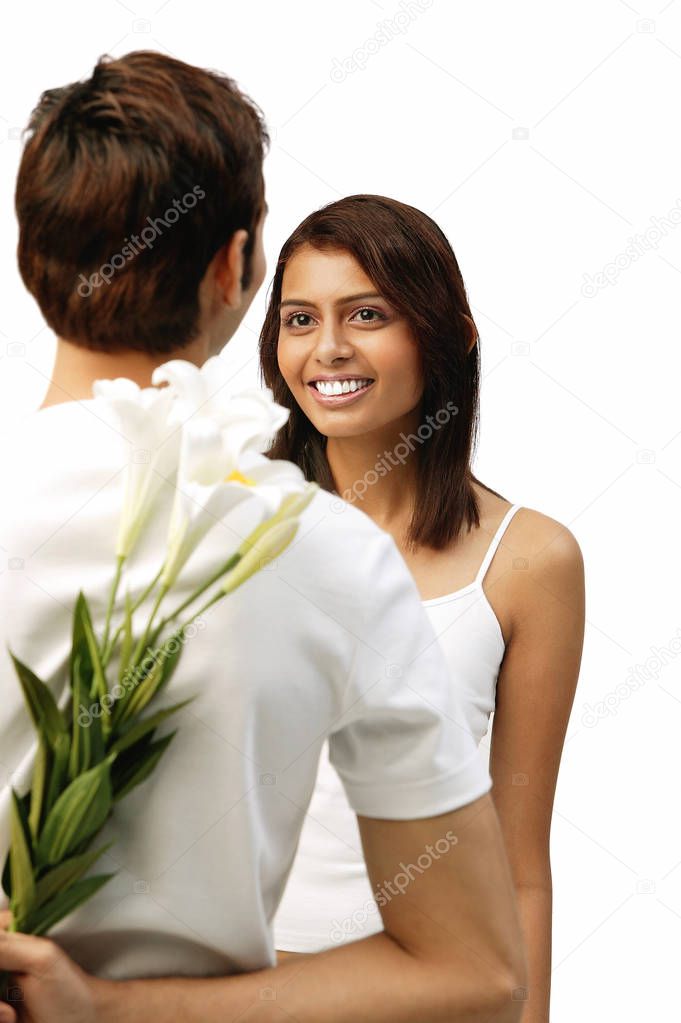Woman smiling at man in front of her
