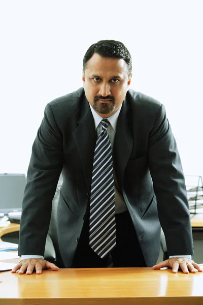 Businessman standing at desk