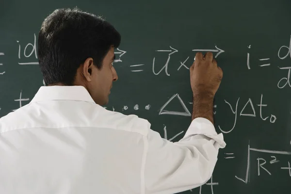Male teacher in classroom — Stock Photo, Image