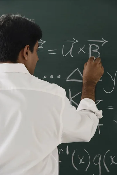 Male teacher in classroom — Stock Photo, Image