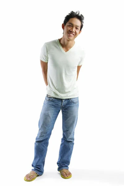 Mladý muž v džínách a tričku — Stock fotografie