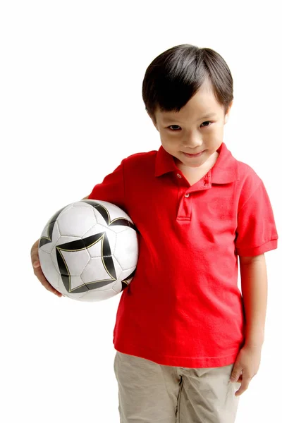 Menino segurando bola de futebol — Fotografia de Stock