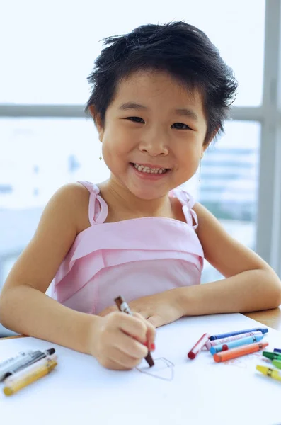 Young girl drawing Royalty Free Stock Images