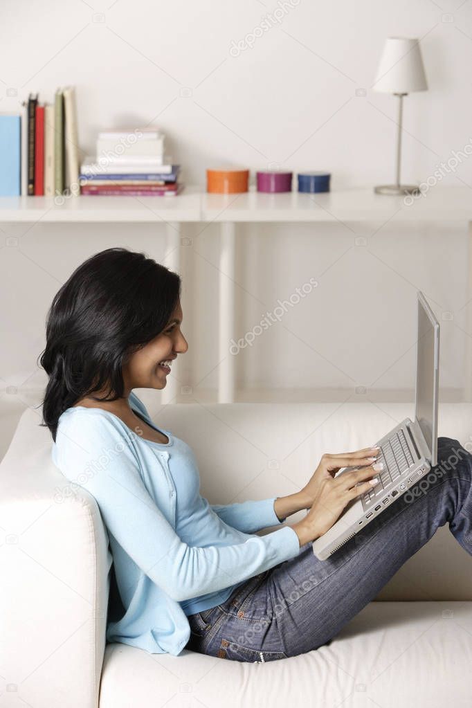 woman at home using laptop
