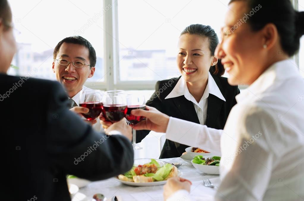 Executives toasting with wine