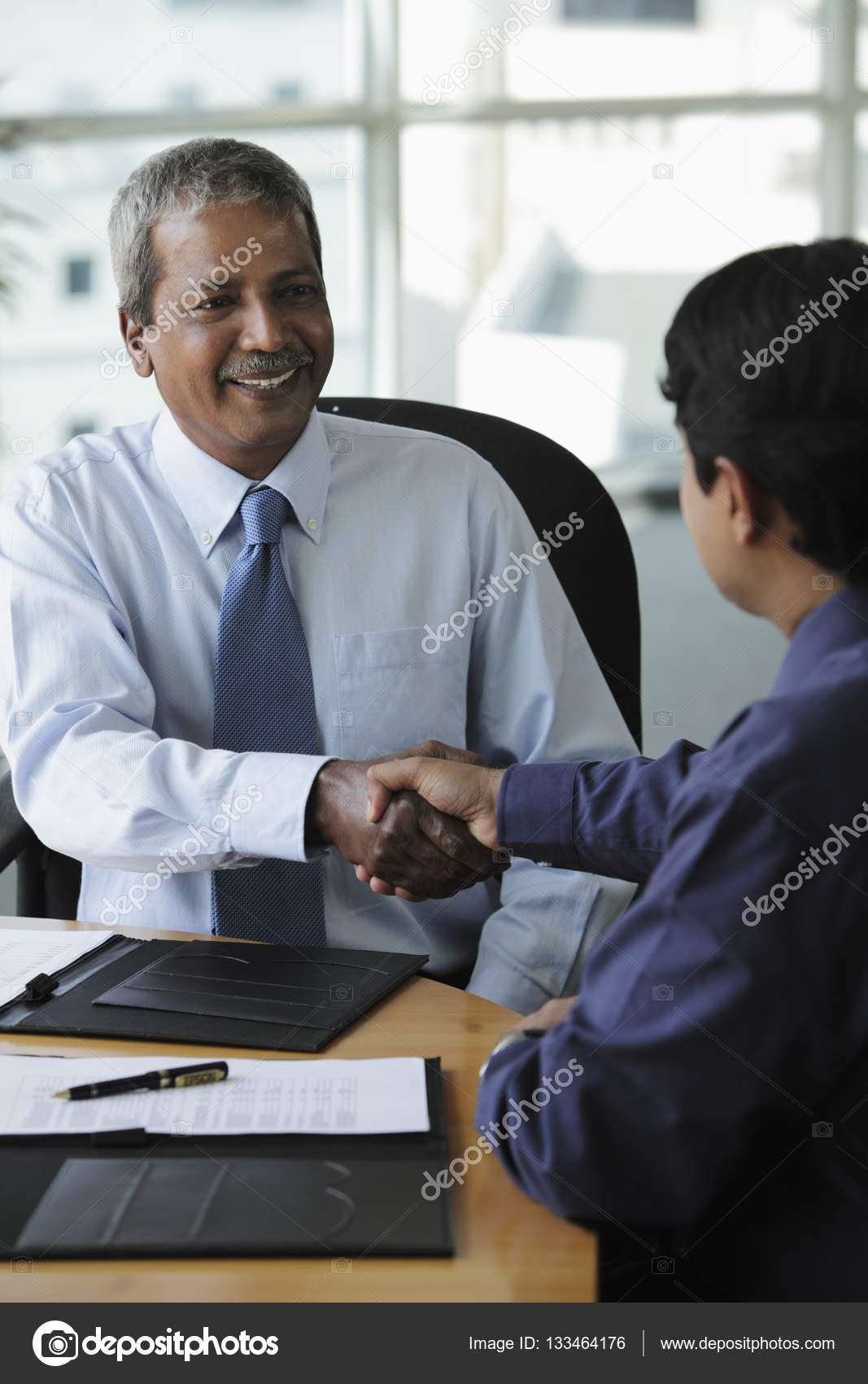 Businessmen shaking hands — Stock Photo © MicrostockAsia 133464176