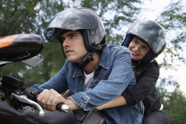 couple riding motorbike