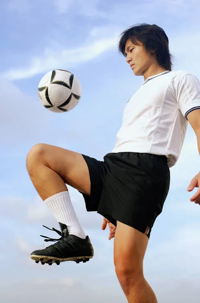 man in soccer uniform