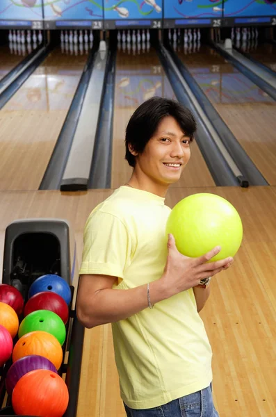 Man holding bowling ball