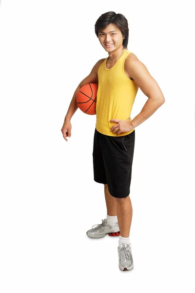Man holding basketball under arm — Stock Photo, Image