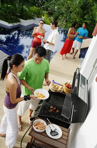 Friends at barbeque party — Stock Photo, Image