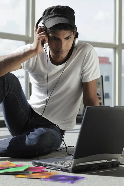 young man listening to music