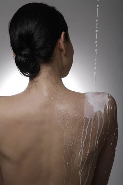woman washed body with milk