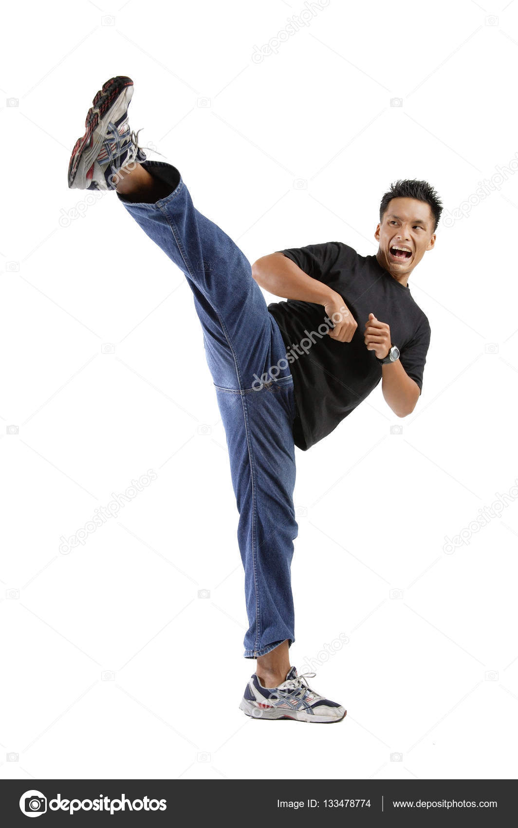 Young man kicking Stock Photo by ©MicrostockAsia 133478774