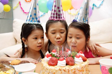 Little girls celebrating a birthday clipart
