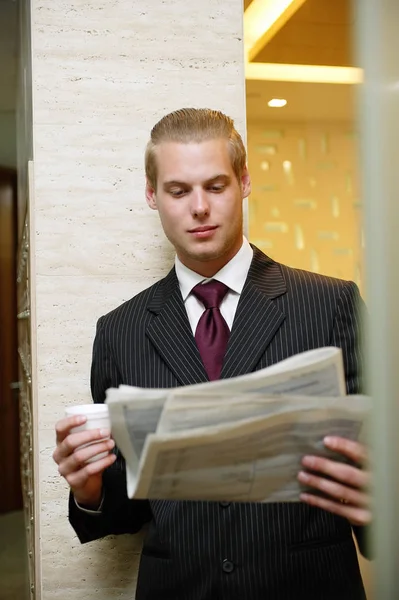 Businessman reading newspaper — Stock Photo, Image