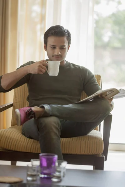 Man sitting in armchair