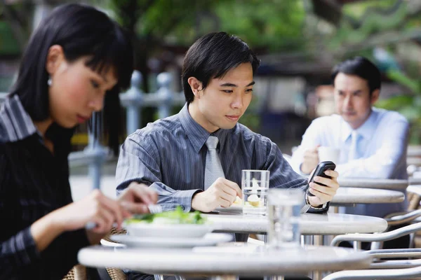 Business people at outdoor cafe