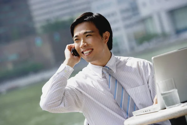 Businessman sitting at outdoor cafe