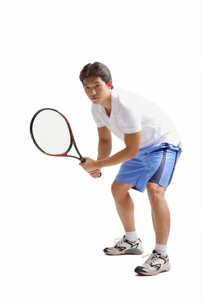 Mann hält Tennisschläger in der Hand — Stockfoto