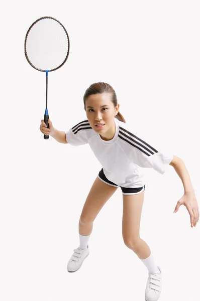 Mulher segurando raquete de badminton — Fotografia de Stock