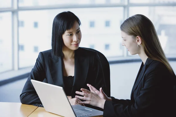 women in front of laptop