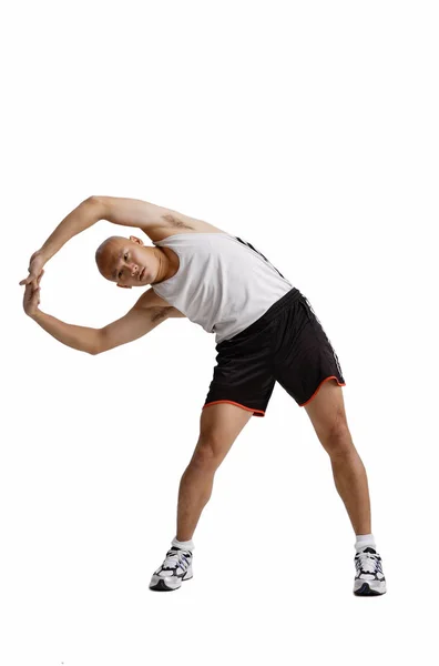 Hombre haciendo ejercicio de estiramiento — Foto de Stock
