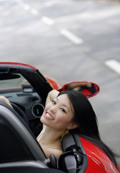 Woman in sports car