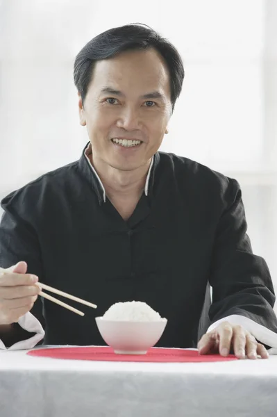 Man with bowl of rice — Stock Photo, Image