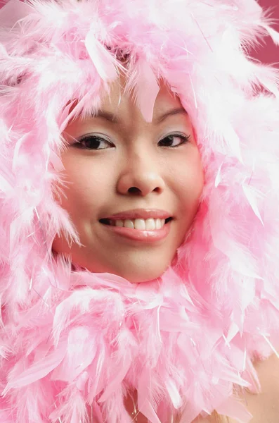 Woman with pink feathers