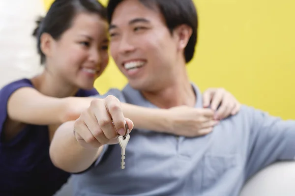 Woman embracing man from behind