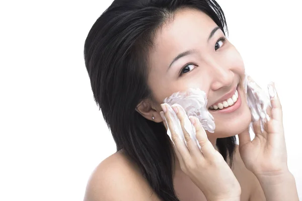 Woman with soap on face — Stock Photo, Image