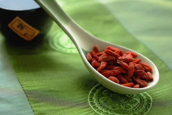 Dried fruit in ceramic spoon — Stock Photo, Image