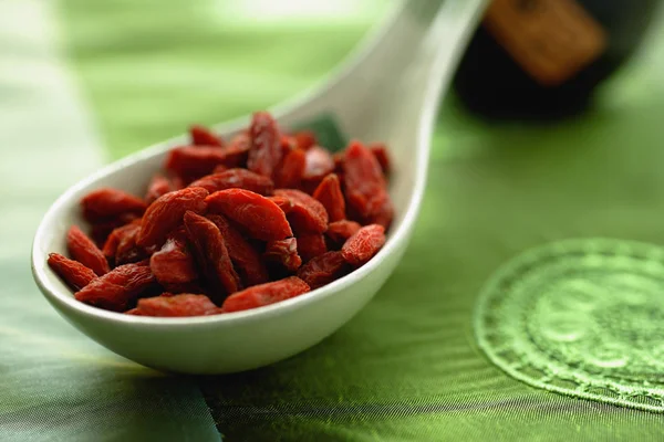 Dried fruit in ceramic spoon — Stock Photo, Image